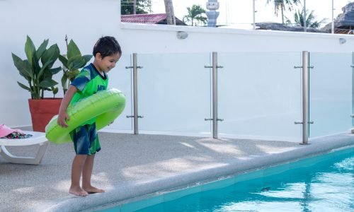 cute-happy-little-boy-having-fun-in-swimming-pool-2026-03-26-08-43-45-utc