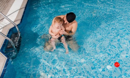 overhead-view-of-smiling-swim-coach-in-swimming-ca-2026-03-12-22-40-11-utc-scaled.jpg